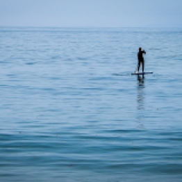 a_photo_of_a_single_paddle_surfer